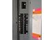 Electrical panel featuring clearly labeled breakers and safety information at 1172 Chelsea Ln, Holiday, FL 34691