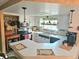 Well-lit kitchen with white cabinetry, a peninsula counter, and an adjacent dining area at 1172 Chelsea Ln, Holiday, FL 34691