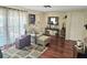 Inviting living room with a comfy armchair, accent rug, and a sunny window, creating a welcoming space for relaxation at 1172 Chelsea Ln, Holiday, FL 34691