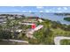 An aerial view showcasing residences near the waterfront with mature landscaping and serene surroundings at 2700 Bayshore Blvd # 2C/578, Dunedin, FL 34698