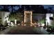 Enclosed brick paver courtyard with string lights and white lattice at 2700 Bayshore Blvd # 2C/578, Dunedin, FL 34698