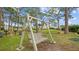 Relax on the outdoor swing set within a well-maintained community green space at 2700 Bayshore Blvd # 2C/578, Dunedin, FL 34698