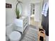 Modern bathroom with single vanity, gray tile floor and view to another room at 4154 Sinclair Pl, Land O Lakes, FL 34639