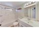 Clean bathroom with marble-look tile and updated vanity at 10162 115Th Ave, Largo, FL 33773