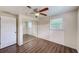 Bright bedroom with mirrored closet doors and wood-look flooring at 10162 115Th Ave, Largo, FL 33773