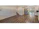 Spacious dining area with wood-look floors and view of kitchen at 10162 115Th Ave, Largo, FL 33773