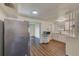Modern kitchen with white cabinets, quartz countertops, and stainless steel appliances at 10162 115Th Ave, Largo, FL 33773
