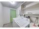 Laundry room with washer, dryer, and built-in shelving at 10162 115Th Ave, Largo, FL 33773