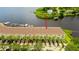 Waterfront townhomes featuring private parking, mature palms, and easy access to boat docks at 163 Brent Cir, Oldsmar, FL 34677