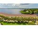 Waterfront townhomes featuring private parking, mature palms, and easy access to boat docks at 163 Brent Cir, Oldsmar, FL 34677