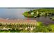 Scenic waterfront townhomes with lush landscaping, boat docks, and serene lake views at 163 Brent Cir, Oldsmar, FL 34677