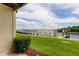 Green lawn with a partial view of the water and boat dock at 163 Brent Cir, Oldsmar, FL 34677