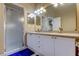 Bright bathroom featuring a walk-in shower, double sink vanity, and modern lighting at 163 Brent Cir, Oldsmar, FL 34677