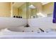 Close up on the large triangular shaped soaking tub with jets at 163 Brent Cir, Oldsmar, FL 34677