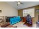 Bedroom featuring ceiling fan, chair, desk, and twin bed at 163 Brent Cir, Oldsmar, FL 34677