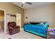 Bedroom featuring ceiling fan, comfortable chair and twin bed at 163 Brent Cir, Oldsmar, FL 34677
