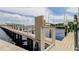 Well maintained wooden dock with white railings on the water at 163 Brent Cir, Oldsmar, FL 34677