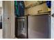 Functional laundry room with modern washer and dryer units, and overhead storage at 163 Brent Cir, Oldsmar, FL 34677