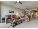 Open-concept living room with plush seating adjacent to dining area and kitchen at 163 Brent Cir, Oldsmar, FL 34677
