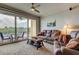 Comfortable living room with plush seating and balcony access offering picturesque waterfront views at 163 Brent Cir, Oldsmar, FL 34677