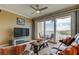 Comfortable living room with plush seating and balcony access with water views at 163 Brent Cir, Oldsmar, FL 34677