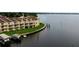 Waterfront townhomes featuring private balconies, green space, and convenient boat docks at 163 Brent Cir, Oldsmar, FL 34677