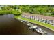 Rear of waterfront townhome with private boat docks, green space, and tranquil water views at 163 Brent Cir, Oldsmar, FL 34677