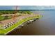 Waterfront townhome featuring balconies, green space, and boat docks for easy water access at 163 Brent Cir, Oldsmar, FL 34677