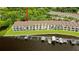 Waterfront townhome featuring private balconies, lush greenery, and convenient boat docks at 163 Brent Cir, Oldsmar, FL 34677