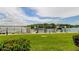 Beautiful waterfront view with a well-maintained lawn and private dock at 163 Brent Cir, Oldsmar, FL 34677