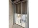 Unfinished basement walls and opening to storage with painted frame and concrete floor for a new homeowner to design at 2570 Gary Cir # 3, Dunedin, FL 34698