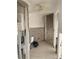 Bathroom during renovation with removed drywall, exposed plumbing, and a new toilet installation at 2570 Gary Cir # 3, Dunedin, FL 34698