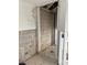 Bathroom undergoing renovation with exposed walls, plumbing fixtures and tiled flooring at 2570 Gary Cir # 3, Dunedin, FL 34698