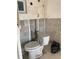 A bathroom under renovation with bare walls and a toilet at 2570 Gary Cir # 3, Dunedin, FL 34698