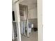 Bathroom is in the middle of renovation with bare walls and a toilet at 2570 Gary Cir # 3, Dunedin, FL 34698
