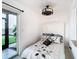 Cozy bedroom with a queen bed, and access to a waterfront view at 2570 Gary Cir # 3, Dunedin, FL 34698