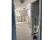 Tiled floors leading into a kitchen under renovation with no appliances at 2570 Gary Cir # 3, Dunedin, FL 34698