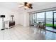 Spacious living room with water views and a dining area set near the sliding doors at 2570 Gary Cir # 3, Dunedin, FL 34698