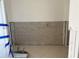 Partially renovated room with tile floors at 2570 Gary Cir # 3, Dunedin, FL 34698
