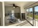 Living space during renovation, featuring sliding glass doors with water view and covered appliances at 2570 Gary Cir # 3, Dunedin, FL 34698