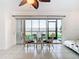 Bright living space featuring a dining set and sliding doors with water view at 2570 Gary Cir # 3, Dunedin, FL 34698