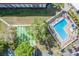 An aerial view showing pool and shuffleboard, lush landscaping, and ample parking at 2700 Bayshore Blvd # 559, Dunedin, FL 34698