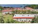 An aerial view features the property's townhomes with red tile roofs and green spaces at 2700 Bayshore Blvd # 559, Dunedin, FL 34698