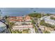 Aerial view of a community with red roofs, lush trees and waterfront access at 2700 Bayshore Blvd # 559, Dunedin, FL 34698