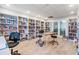 Well-lit community library with extensive bookshelves, comfortable seating, and reading area at 2700 Bayshore Blvd # 559, Dunedin, FL 34698