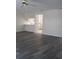 A bright living room with gray flooring that opens into the kitchen space at 2700 Bayshore Blvd # 559, Dunedin, FL 34698