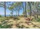 A park featuring picnic tables by the water with mature trees and a playground at 2700 Bayshore Blvd # 559, Dunedin, FL 34698