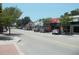 Charming street view of local shops and parked cars, showcasing the commercial area at 2700 Bayshore Blvd # 559, Dunedin, FL 34698