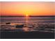 Beautiful sunset over the water reflecting vibrant colors with boats in the foreground at 2700 Bayshore Blvd # 559, Dunedin, FL 34698