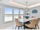 Bright dining room with ocean view, seating for six at 5000 Gulf Blvd # 704, St Pete Beach, FL 33706